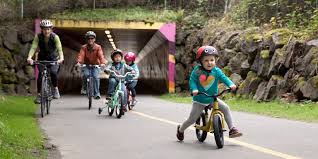 Family riding bikes on a cycle path