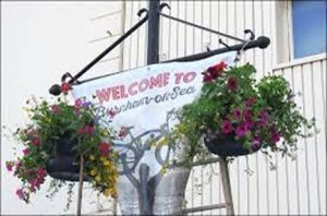 Photo showing hanging baskets on lampposts