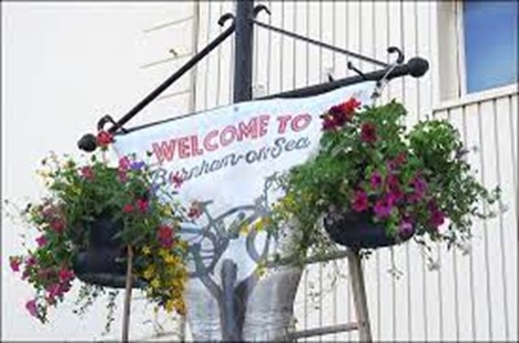Photo showing hanging baskets on lampposts