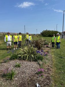 Growing Group members with planted beds on the Esplanade